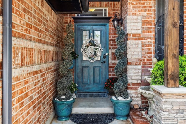 704 N Geronimo Way, Mustang, OK 73064 - property entrance featuring brick siding