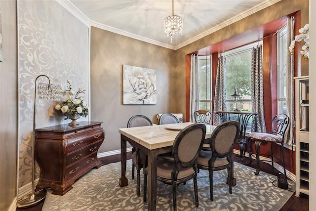 704 N Geronimo Way, Mustang, OK 73064 - dining room featuring dark wood-style flooring, a chandelier, and ornamental molding