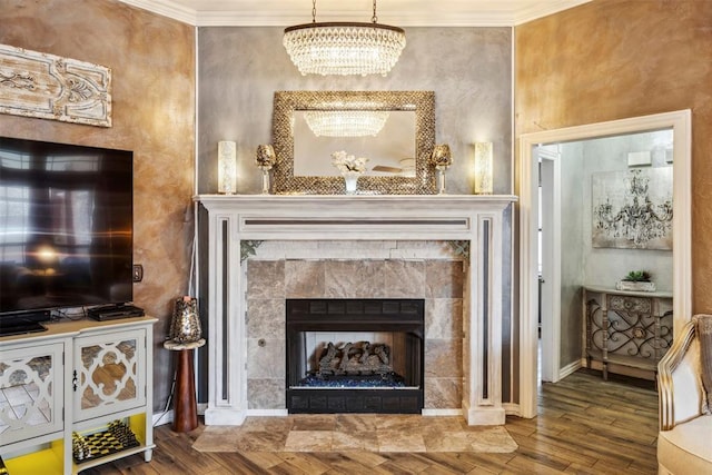 704 N Geronimo Way, Mustang, OK 73064 - detailed view of a chandelier, ornamental molding, wood finished floors, and a tile fireplace