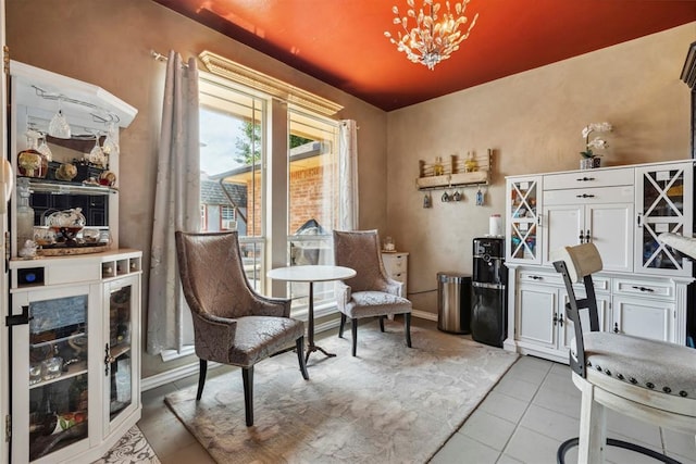 704 N Geronimo Way, Mustang, OK 73064 - sitting room with a chandelier and tile patterned floors