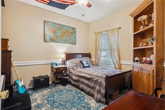704 N Geronimo Way, Mustang, OK 73064 - bedroom featuring ceiling fan and baseboards