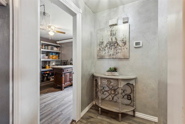 704 N Geronimo Way, Mustang, OK 73064 - corridor with wood finished floors and a textured wall