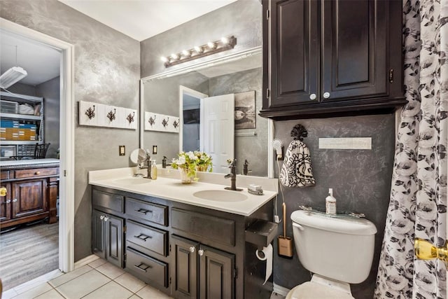 704 N Geronimo Way, Mustang, OK 73064 - bathroom featuring double vanity and tile patterned floors