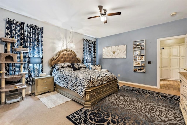 704 N Geronimo Way, Mustang, OK 73064 - bedroom featuring ceiling fan and baseboards