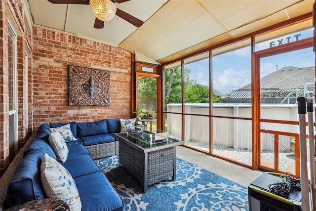 704 N Geronimo Way, Mustang, OK 73064 - sunroom / solarium with ceiling fan, vaulted ceiling, an outdoor living space, carpet, and brick wall