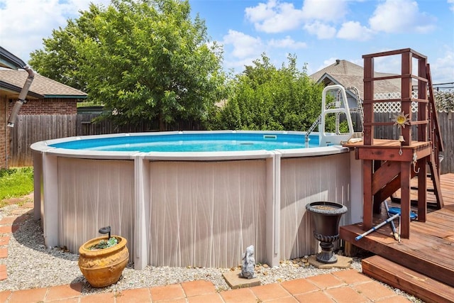704 N Geronimo Way, Mustang, OK 73064 - swimming pool with a deck