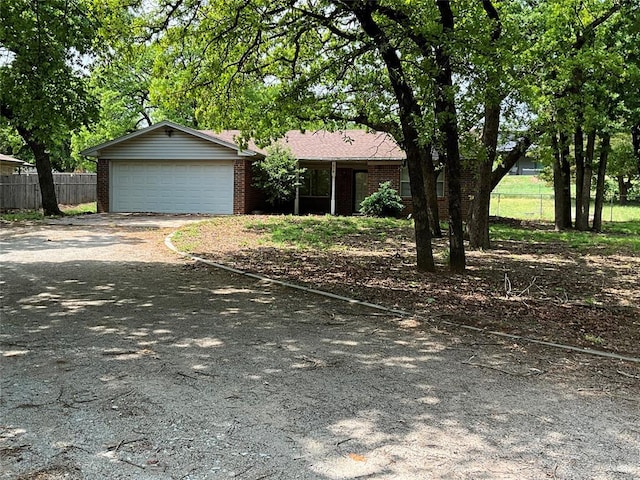 3014 S Mission St, Anadarko, OK 73005 - single story home with brick siding, an attached garage, and driveway