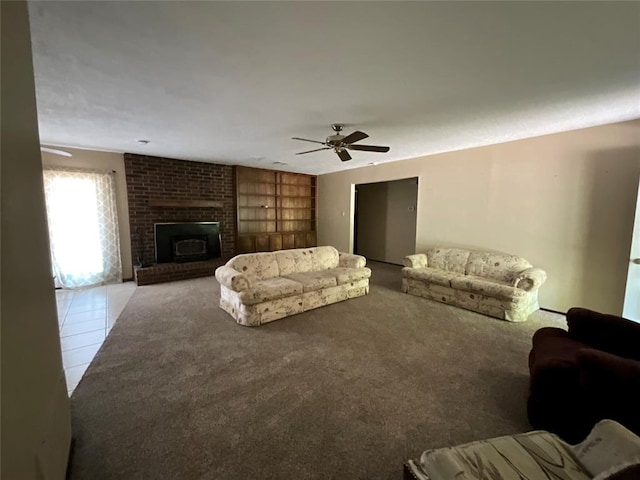 3014 S Mission St, Anadarko, OK 73005 - carpeted living area with a ceiling fan, a brick fireplace, and tile patterned floors