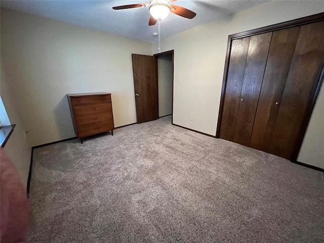 3014 S Mission St, Anadarko, OK 73005 - unfurnished bedroom with light carpet, a closet, and a ceiling fan