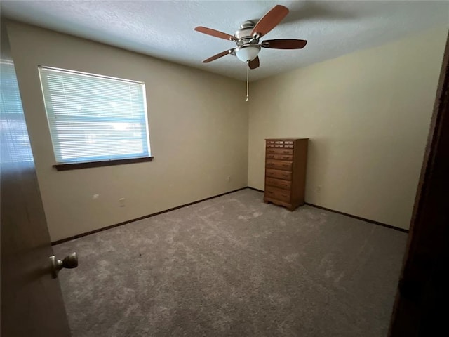 3014 S Mission St, Anadarko, OK 73005 - unfurnished bedroom featuring carpet flooring and a ceiling fan