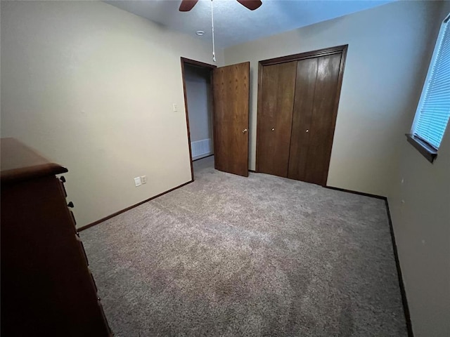3014 S Mission St, Anadarko, OK 73005 - unfurnished bedroom featuring carpet, a ceiling fan, and a closet