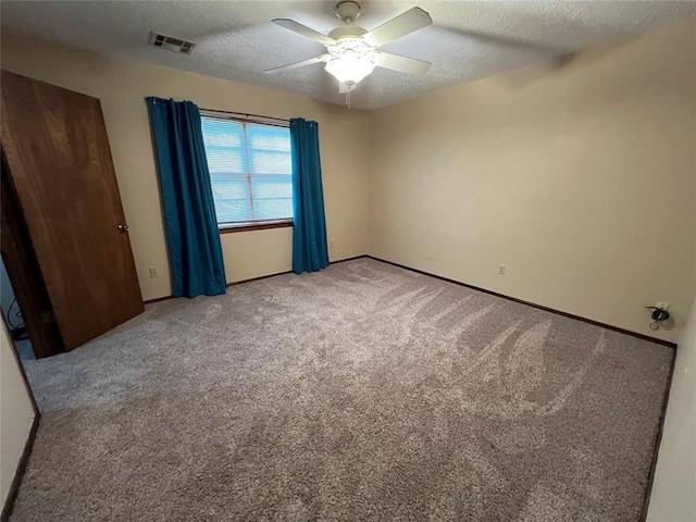 3014 S Mission St, Anadarko, OK 73005 - empty room featuring a textured ceiling, light carpet, and ceiling fan