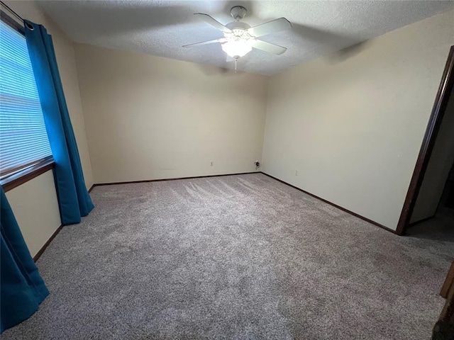 3014 S Mission St, Anadarko, OK 73005 - unfurnished room with carpet floors, a ceiling fan, and a textured ceiling