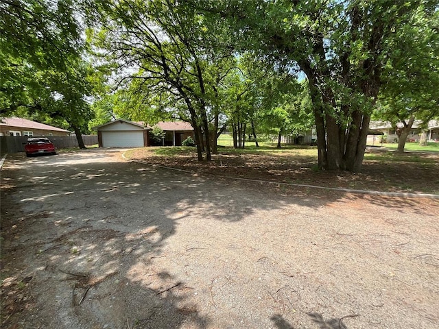 3014 S Mission St, Anadarko, OK 73005 - view of yard with a detached garage and an outdoor structure