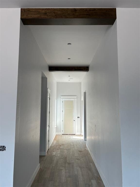 10109 NW 100th St, Yukon, OK 73099 - corridor with beam ceiling, baseboards, and wood finished floors
