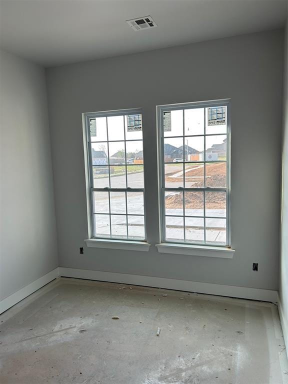 10109 NW 100th St, Yukon, OK 73099 - empty room featuring plenty of natural light and baseboards