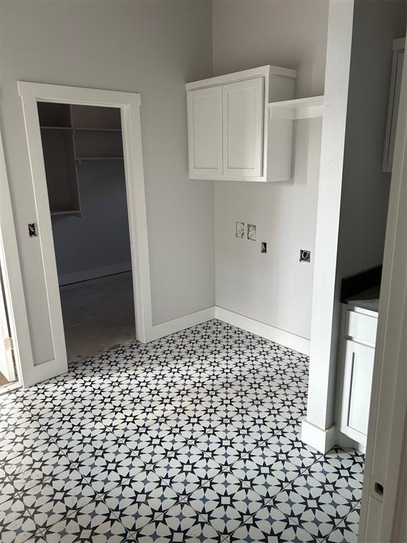 10109 NW 100th St, Yukon, OK 73099 - laundry room with baseboards and tile patterned floors