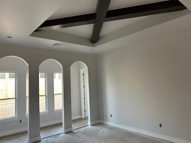 10109 NW 100th St, Yukon, OK 73099 - empty room with baseboards, coffered ceiling, and beam ceiling