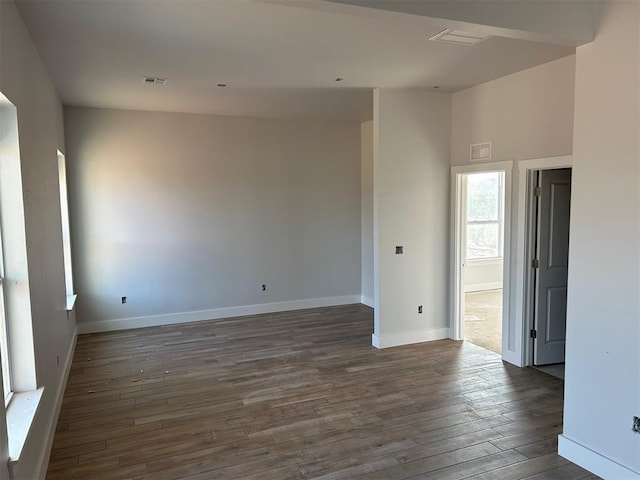 10109 NW 100th St, Yukon, OK 73099 - unfurnished room with dark wood-type flooring and baseboards