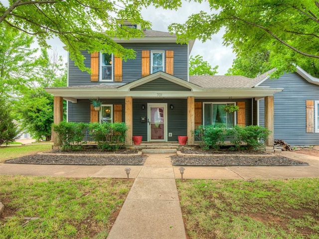 701 N Wentz St, Guthrie, OK 73044 - traditional style home featuring covered porch and roof with shingles