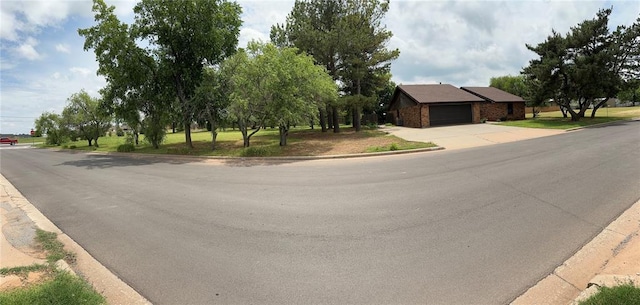 2308 Lynn Ln, Weatherford, OK 73096 - view of asphalt road with curbs
