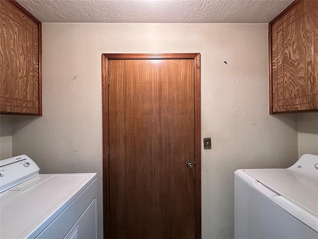 2308 Lynn Ln, Weatherford, OK 73096 - laundry area with cabinet space, independent washer and dryer, and a textured ceiling