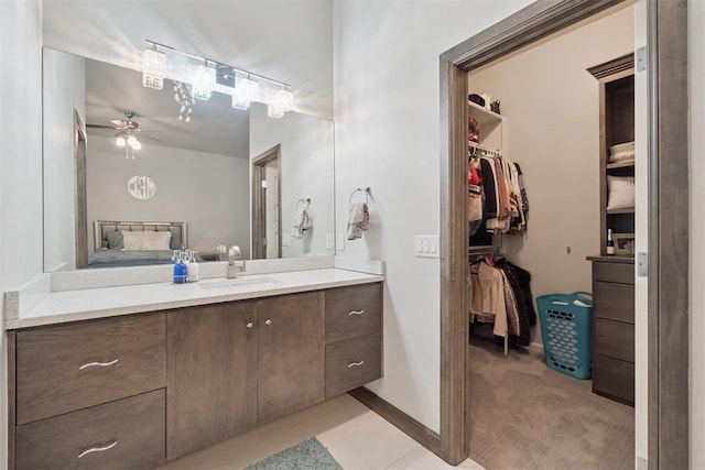 3532 NW 173rd Cir, Edmond, OK 73012 - ensuite bathroom with vanity, a ceiling fan, and a spacious closet