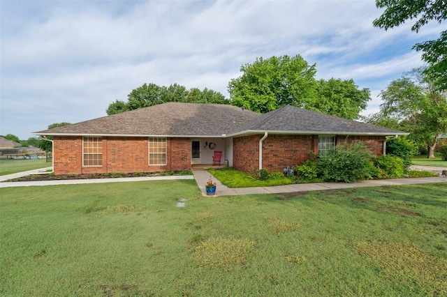 106 Dee Dee Dr, Shawnee, OK 74804 - single story home with brick siding, a front lawn, and roof with shingles