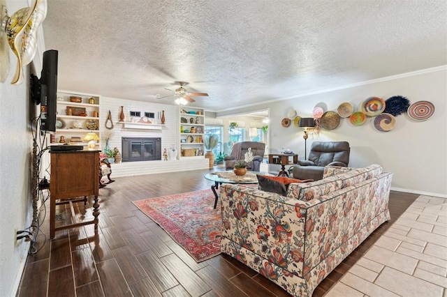 106 Dee Dee Dr, Shawnee, OK 74804 - living area with a ceiling fan, wood finished floors, a textured ceiling, ornamental molding, and baseboards