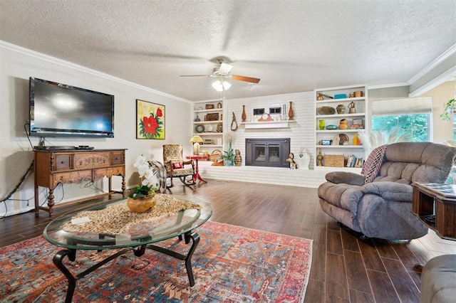 106 Dee Dee Dr, Shawnee, OK 74804 - living area featuring a textured ceiling, crown molding, ceiling fan, wood finished floors, and a brick fireplace