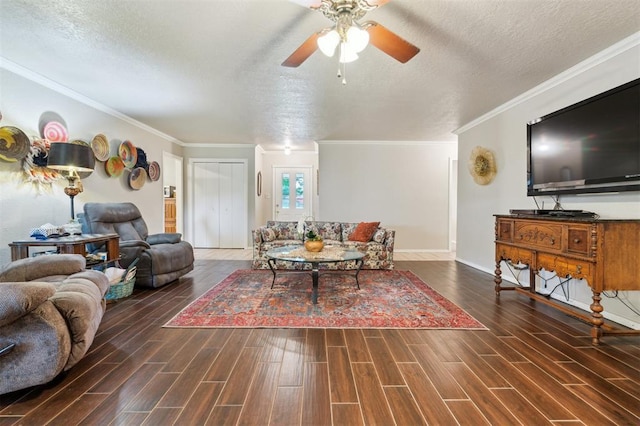 106 Dee Dee Dr, Shawnee, OK 74804 - living area with a ceiling fan, wood finished floors, a textured ceiling, ornamental molding, and baseboards