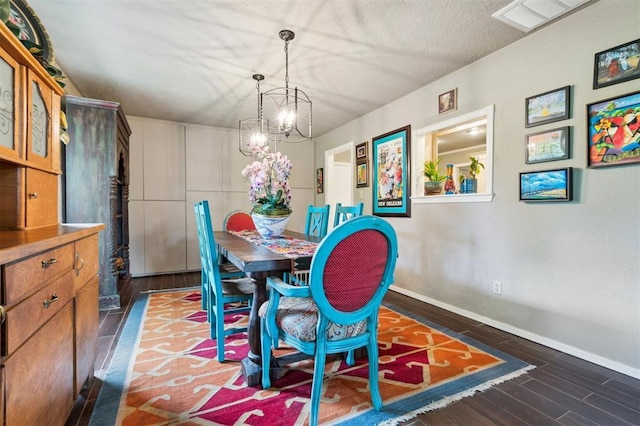 106 Dee Dee Dr, Shawnee, OK 74804 - dining space with a chandelier, baseboards, and dark wood finished floors