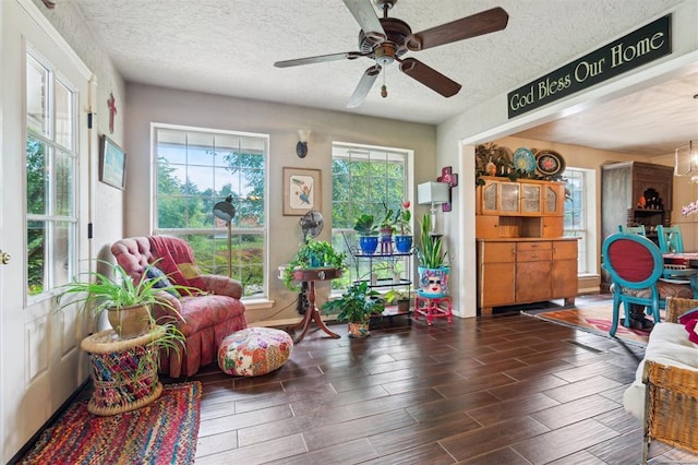 106 Dee Dee Dr, Shawnee, OK 74804 - living area with a textured ceiling, healthy amount of natural light, a ceiling fan, and wood finished floors