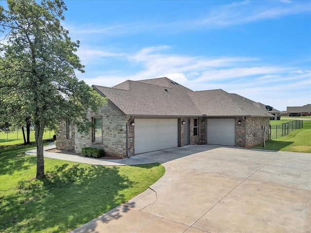 2383 Fox Ln, Blanchard, OK 73010 - view of front of property featuring a garage, concrete driveway, roof with shingles, and stone siding
