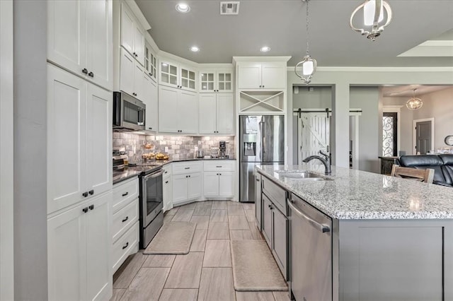 2383 Fox Ln, Blanchard, OK 73010 - kitchen featuring appliances with stainless steel finishes, a sink, tasteful backsplash, white cabinets, and recessed lighting