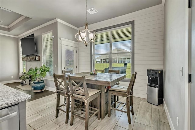 2383 Fox Ln, Blanchard, OK 73010 - dining space featuring baseboards, a chandelier, crown molding, and wood finish floors