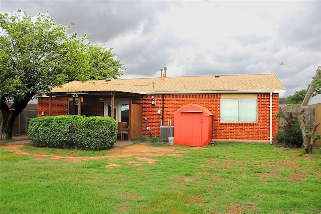 900 Hairston St, Altus, OK 73521 - rear view of property with central AC unit and brick siding