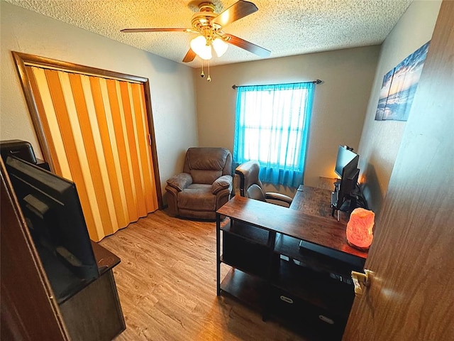 900 Hairston St, Altus, OK 73521 - office space featuring a textured ceiling, ceiling fan, and light wood-type flooring