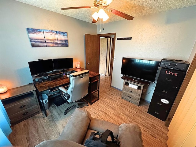 900 Hairston St, Altus, OK 73521 - office area with a textured ceiling, a ceiling fan, and wood finished floors