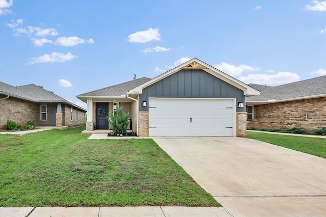 19908 Taggert Dr, Edmond, OK 73012 - view of front of house featuring an attached garage, a front lawn, brick siding, concrete driveway, and board and batten siding