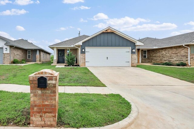 19908 Taggert Dr, Edmond, OK 73012 - ranch-style home featuring a garage, board and batten siding, a front yard, and concrete driveway