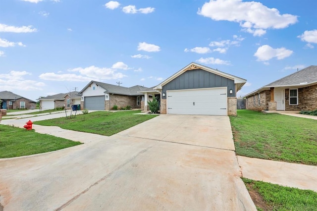 19908 Taggert Dr, Edmond, OK 73012 - ranch-style home featuring board and batten siding, brick siding, a front lawn, driveway, and a garage