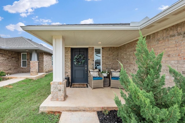 19908 Taggert Dr, Edmond, OK 73012 - entrance to property with a lawn, brick siding, and a porch