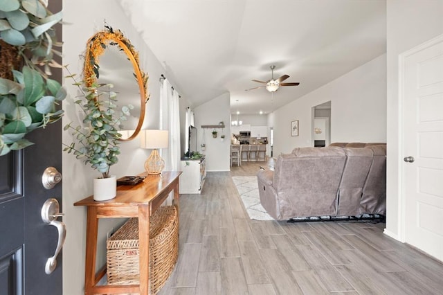 19908 Taggert Dr, Edmond, OK 73012 - living area with ceiling fan, light wood-type flooring, and lofted ceiling