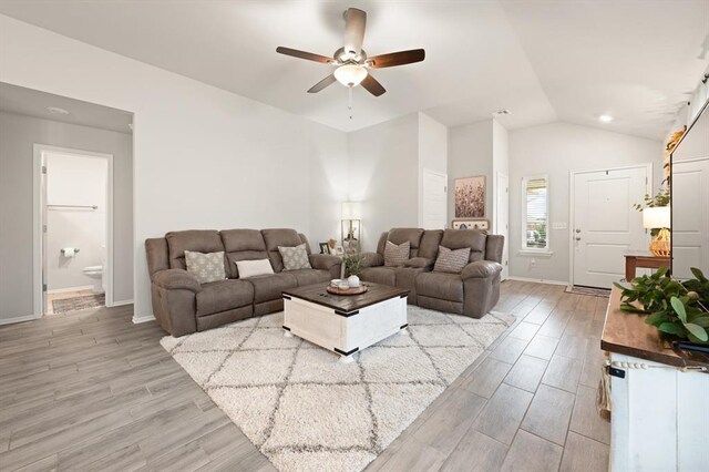 19908 Taggert Dr, Edmond, OK 73012 - living room featuring a ceiling fan, lofted ceiling, light wood finished floors, and baseboards