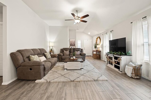 19908 Taggert Dr, Edmond, OK 73012 - living area with ceiling fan, vaulted ceiling, wood finished floors, and baseboards