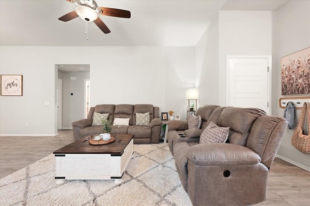 19908 Taggert Dr, Edmond, OK 73012 - living room with a ceiling fan, baseboards, and light wood-style flooring