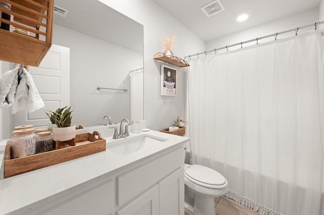 19908 Taggert Dr, Edmond, OK 73012 - full bathroom with vanity, toilet, recessed lighting, and shower / bath combo with shower curtain