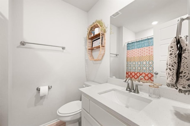 19908 Taggert Dr, Edmond, OK 73012 - bathroom with toilet, vanity, baseboards, and curtained shower