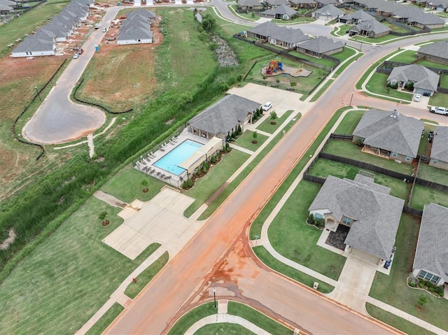 19908 Taggert Dr, Edmond, OK 73012 - aerial view of property's location featuring a pool and nearby suburban area